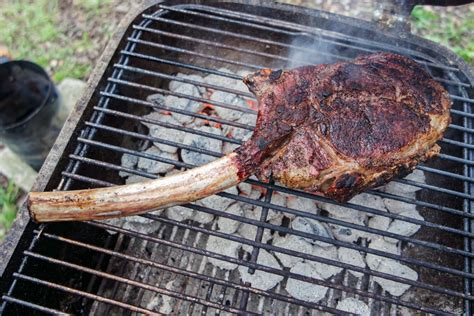 Searing tomahawk steak