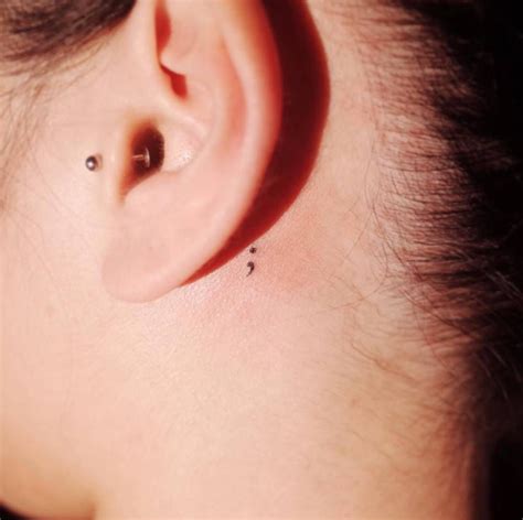 The Unusual Trend Of Semi Colon Tattoos Behind The Ear
