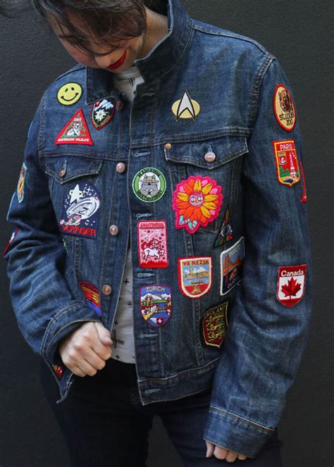 sewing patches on denim jacket