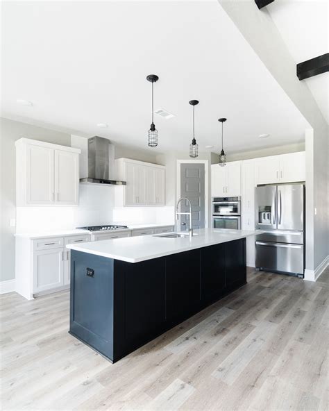 White Kitchen with Gray Slate Herringbone Floor Tiles Transitional