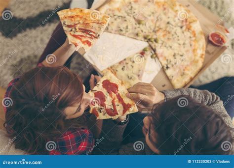 sharing a slice of pizza