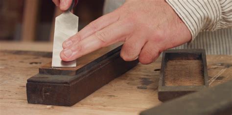 Sharpening A Chisel On A Stone