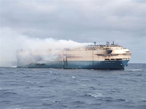 ship loaded with cars burning
