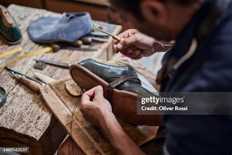 shoemaker working on shoe