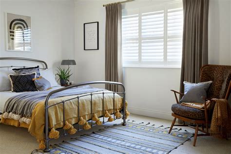 Neutral bedroom. Window behind bed. Bedroom window