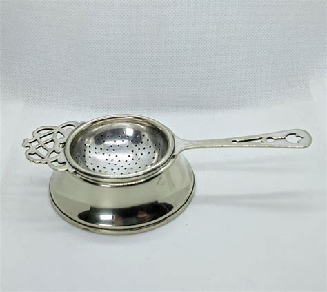 ftn.rocasa.us:silver tea strainer and stand