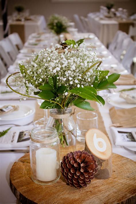 Simple olive branches on tables for boho wedding Wedding table