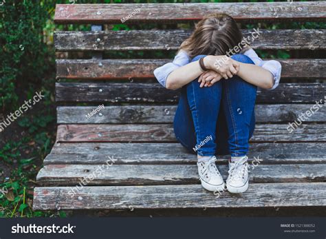 Sitting alone and sad