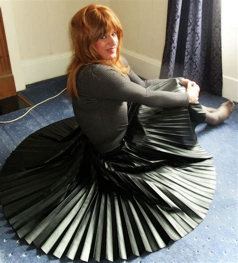 sitting on floor in skirt