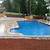 sloped backyard retaining wall for above ground pool on slope