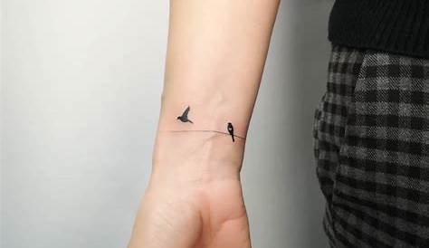 Tiny Birds on Wrist Tattoo by Michał Sukiennik