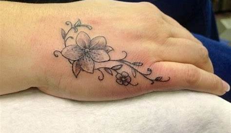 Small Flower Hand Tattoo Pin By Musicechoes On s In 2020 s Holding
