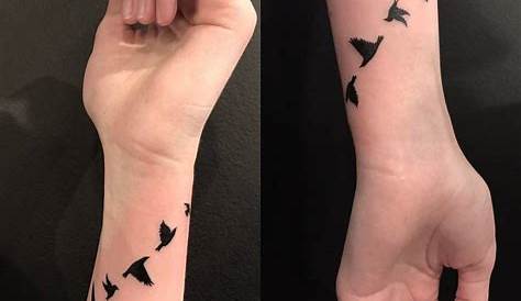coloured flying bird tattoo for girl tattoo on wrist done