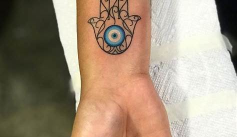 Small Hamsa Evil Eye Tattoo . . Forearm