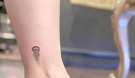 Small Jellyfish Tattoo Minimalistic On The Thigh. The Simple And