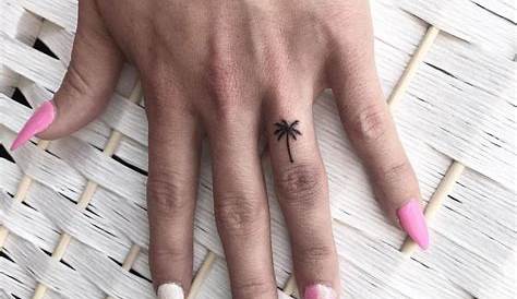 Small palmtree palm tree tattoos on finger and wrist, palm