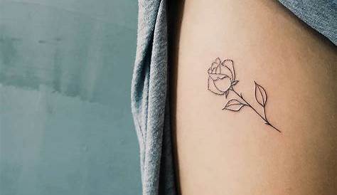 Simple rose tattoo on the thigh by artist Cholo