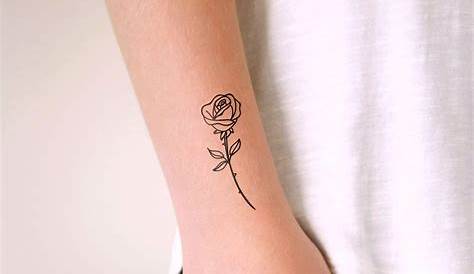 Small Rose Tattoo Small rose tattoo with the word Faith