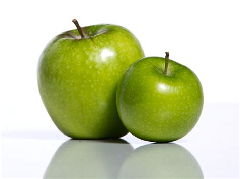An Image of an Apple with a Small Slice at the Side Stock Photo Image