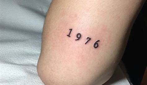 Tiny number 32 tattoo by Kirk Budden inked on the left