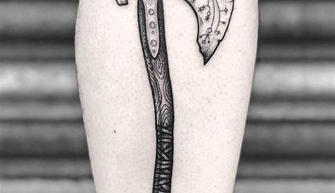 Norse ax tattoo by Lozzy Bones inked on the right calf