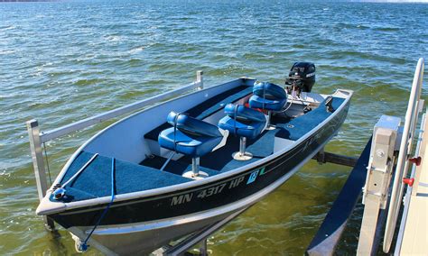 Small aluminum fishing boats in water