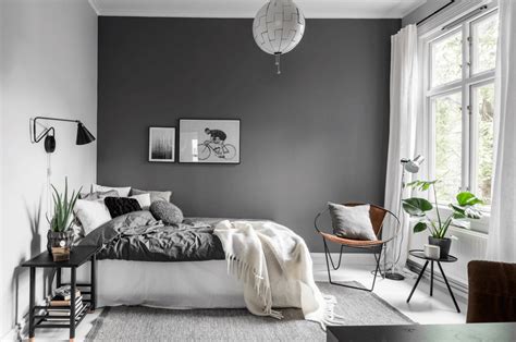 small bedroom grey and white with statement headboard