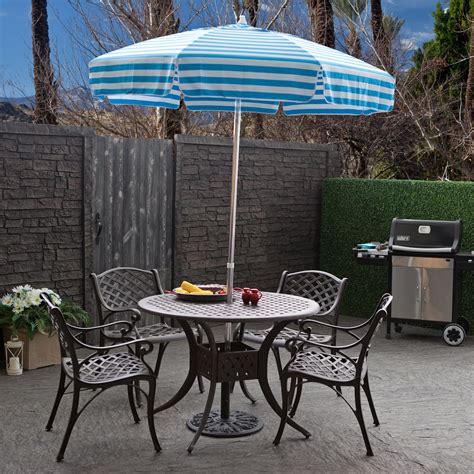 small outdoor bistro set with umbrella