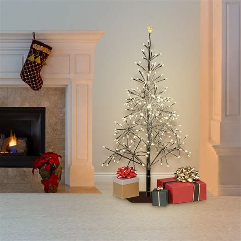 small silver christmas tree with lights