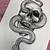 snake in skull tattoo