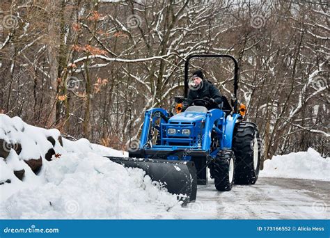 Snow Plowing With Tractor