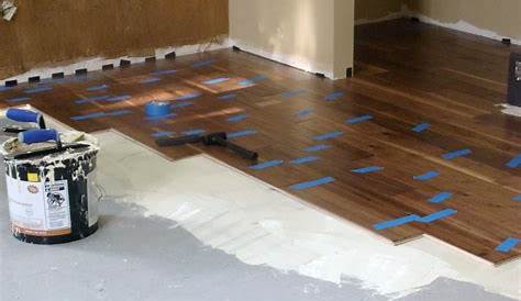 gluing down prefinished SOLID hardwood floors directly over a concrete
