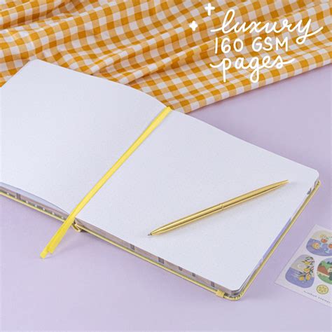 Generate a concise and descriptive alt text for an image about square bullet journal.