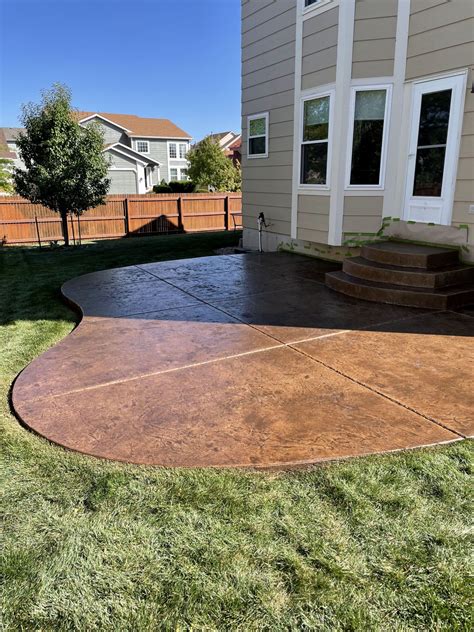 Give a new touch to house by adoring stained concrete patio