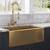 stainless steel farmhouse sink with gold faucet