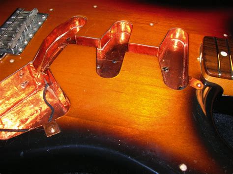 Static Noise When Touching Guitar Strings