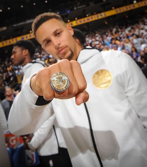 steph curry with his rings