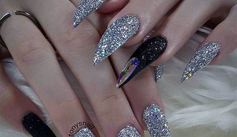 Stiletto Nails Black And Silver With One Chrome Jewels