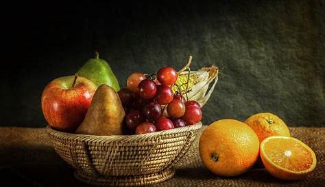 Assorted Fruits arranged as a rustic fruit basket still
