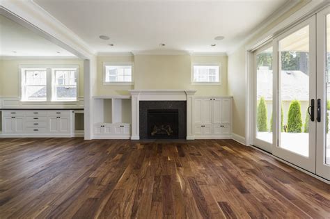 carinsuranceast.us:stock empty living room dark hardwood floors