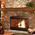 stone fireplace with wood mantel