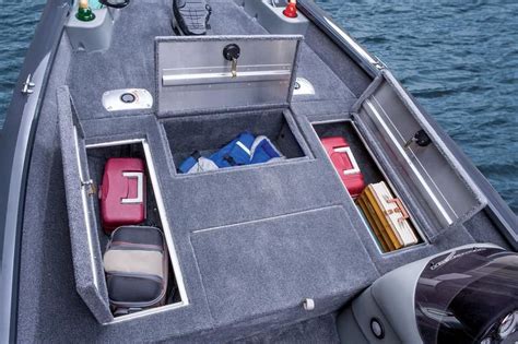 Small aluminum fishing boat with storage compartments