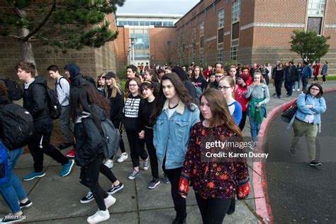 students walk out of school