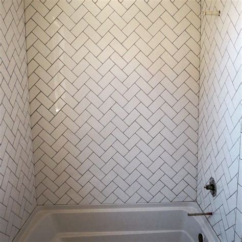Subway tile backsplash in a herringbone pattern Destin Elite Tile
