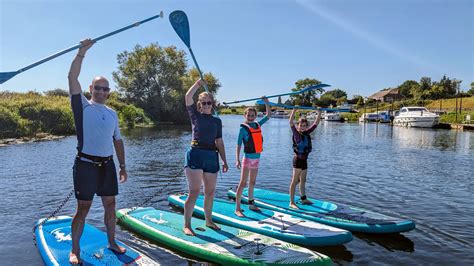 sup instructor helping beginner