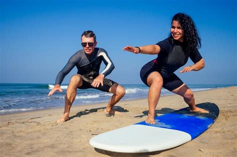 surf instructor demonstrating on beach