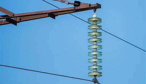 Suspension Type Insulators On Electrical Pole Close Up
