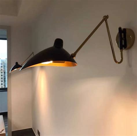 Swing arm wall lamp functional benefits