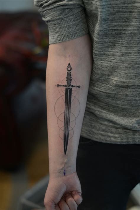 sword tattoo on arm