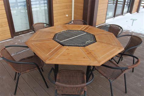 Table With Barbecue In The Middle